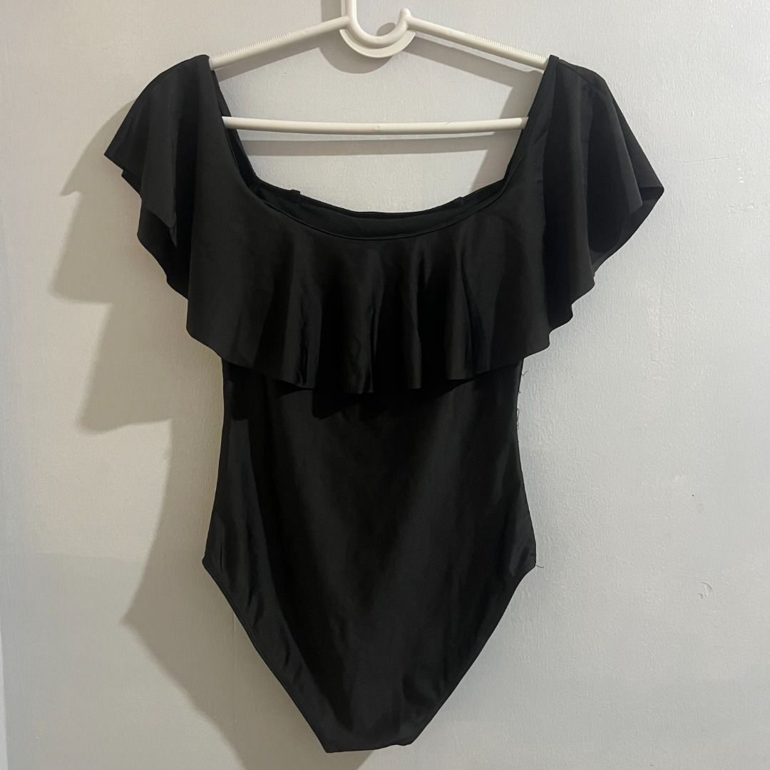 Black Off-Shoulder Ruffle One-Piece Swimsuit (Category: Bikinis & Swimsuits) located in Pasay City. Submitted by leagn_07 (Listing ID 1445015542, Image 3). Description: - Elegant black one-piece swimsuit - Stylish off-the-shoulder design - Features a chic ruffle overlay - Designed for a flattering fit - With slots for pads - Fits M-L.