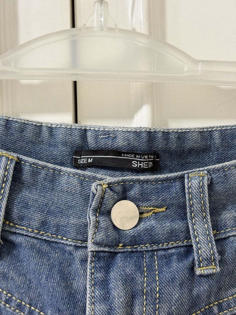 Blue Denim Midi Skirt Size M (Category: Skirts) located in Manila. Submitted by arysellstuff (Listing ID 1445015106, Image 3). Description: - SHEIN Blue Denim Midi Skirt - Size: Medium (M) - Front hem slit for a stylish look - Two functional back pockets - Secure button and zip closure - Origin: Made in Vietnam.