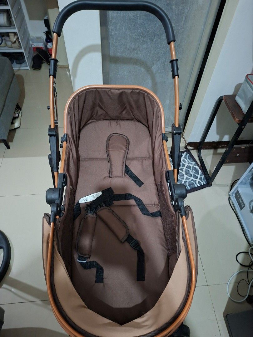 Brown Baby Stroller with Safety Harness (Category: Strollers) located in Manila. Submitted by iloveyou3ooo (Listing ID 1444992814, Image 3). Description: - Brown baby stroller - Secure 5-point safety harness - Metallic brown frame - Black wheels - Black and brown handlebar - Folds for convenient storage - Ideal for walks and travel.