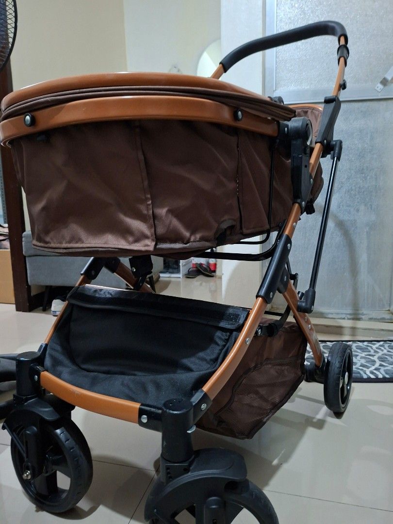 Brown Baby Stroller with Safety Harness (Category: Strollers) located in Manila. Submitted by iloveyou3ooo (Listing ID 1444992814, Image 2). Description: - Brown baby stroller - Secure 5-point safety harness - Metallic brown frame - Black wheels - Black and brown handlebar - Folds for convenient storage - Ideal for walks and travel.