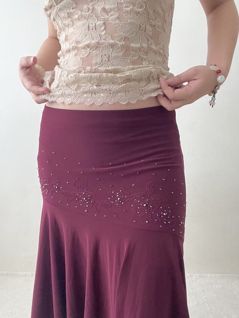 Burgundy beaded asymmetrical skirt (Category: Skirts) located in Dagupan City. Submitted by rarus (Listing ID 1444860752, Image 2). Description: Burgundy beaded asymmetrical skirt • Spandex material • Flattering fit • Flowy • Garterized waist • Lined Waist 29-37” Hips up to up to 42” Length 33” .