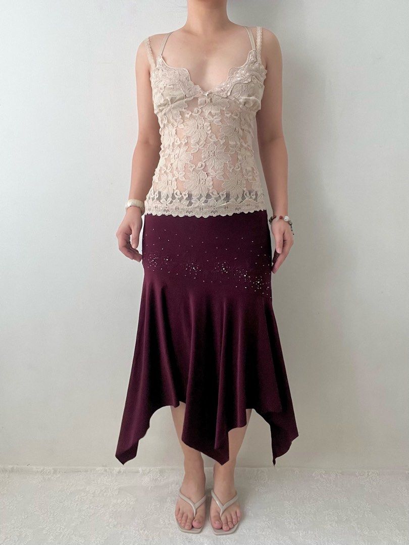 Burgundy beaded asymmetrical skirt (Category: Skirts) located in Dagupan City. Submitted by rarus (Listing ID 1444860752, Image 1). Description: Burgundy beaded asymmetrical skirt • Spandex material • Flattering fit • Flowy • Garterized waist • Lined Waist 29-37” Hips up to up to 42” Length 33” .