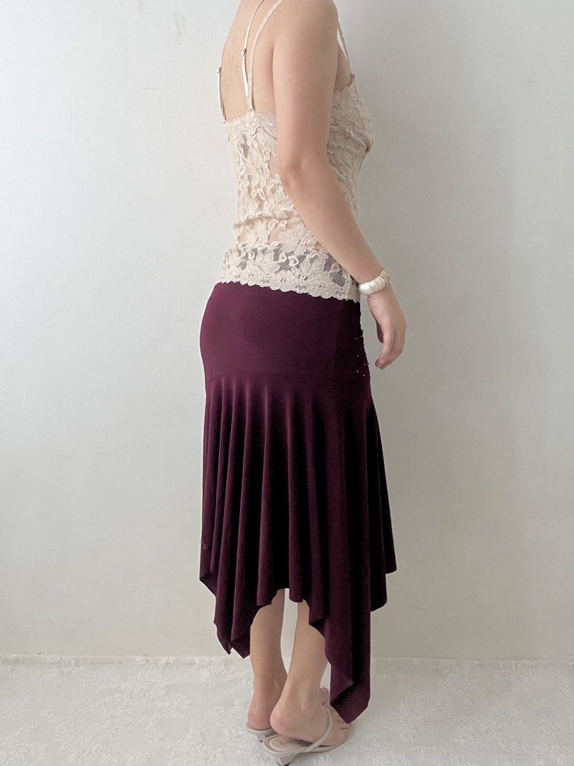 Burgundy beaded asymmetrical skirt (Category: Skirts) located in Dagupan City. Submitted by rarus (Listing ID 1444860752, Image 3). Description: Burgundy beaded asymmetrical skirt • Spandex material • Flattering fit • Flowy • Garterized waist • Lined Waist 29-37” Hips up to up to 42” Length 33” .