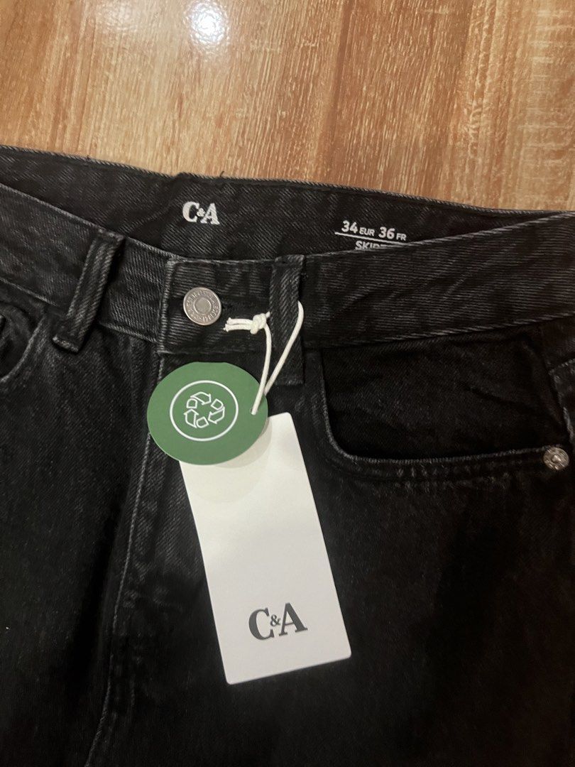 C&A Black Denim Midi Skirt with Front Slit (Category: Skirts) located in Tarlac. Submitted by leyna_aa (Listing ID 1445012917, Image 2). Description: - Brand: C&A - Color: Black - Style: Midi Skirt - Material: Durable Denim - Features: Front slit for easy movement, Classic five-pocket styling - Occasion: Great for casual outfits - Size: 36.