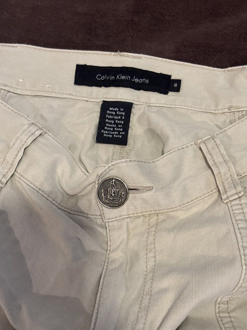 Calvin Klein Jeans Embroidered Cargo Pants (Category: Jeans) located in Manila. Submitted by esstarita (Listing ID 1444947830, Image 2). Description: - Light beige Calvin Klein Jeans cargo pants - Size 10 - Unique floral embroidery down one leg - Button and zip front closure - Multiple functional pockets - Ideal for a stylish casual look.