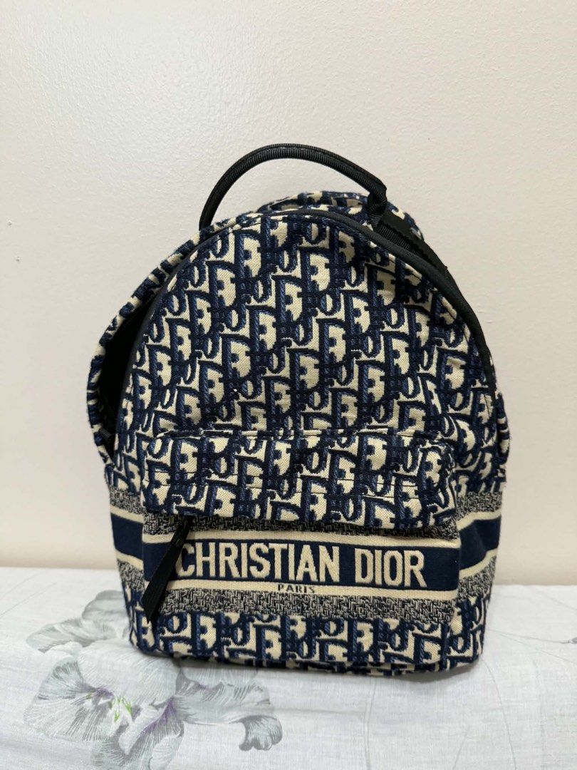 CD Oblique Canvas Backpack (Category: Luxury Bags & Wallets) located in Paranaque City. Submitted by goldboxph (Listing ID 1444984652, Image 1). Description: - Oblique backpack - Iconic navy and cream canvas - Features Christian Dior logo on front strap - Adjustable shoulder straps with branding - Ideal for everyday use or travel - Spacious interior for essentials.