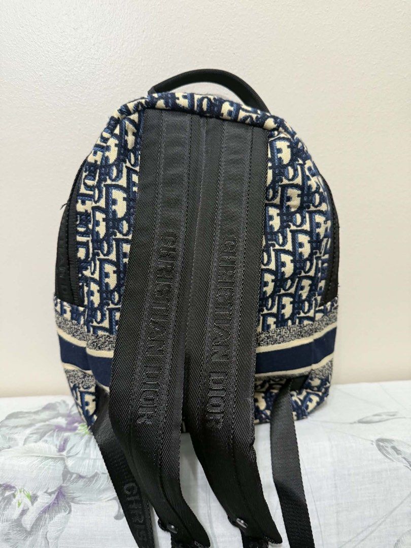 CD Oblique Canvas Backpack (Category: Luxury Bags & Wallets) located in Paranaque City. Submitted by goldboxph (Listing ID 1444984652, Image 2). Description: - Oblique backpack - Iconic navy and cream canvas - Features Christian Dior logo on front strap - Adjustable shoulder straps with branding - Ideal for everyday use or travel - Spacious interior for essentials.