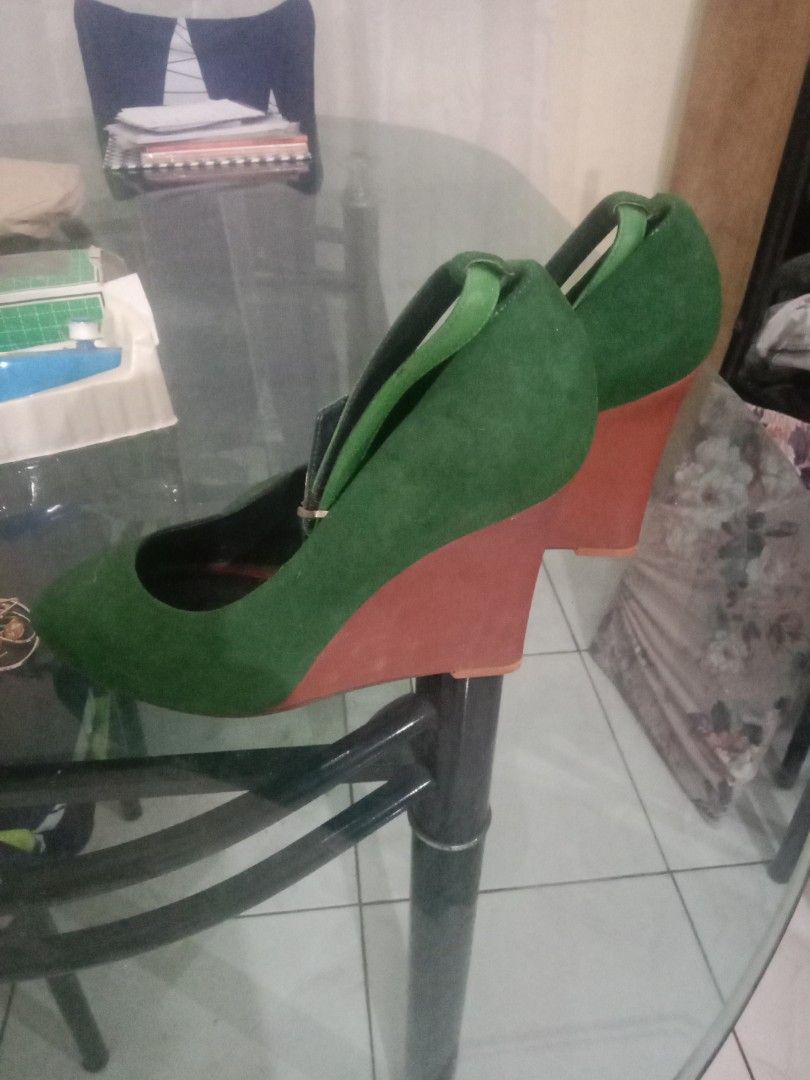 Celine Paris Green Suede Wedge Heels (Category: Wedges) located in Rosario. Submitted by gmarilyn1934608 (Listing ID 1444860414, Image 2). Description: - Celine Paris green suede wedge heels - Contrasting reddish-brown wedge heel - Ankle strap with small gold buckle detail - Soles show some wear.