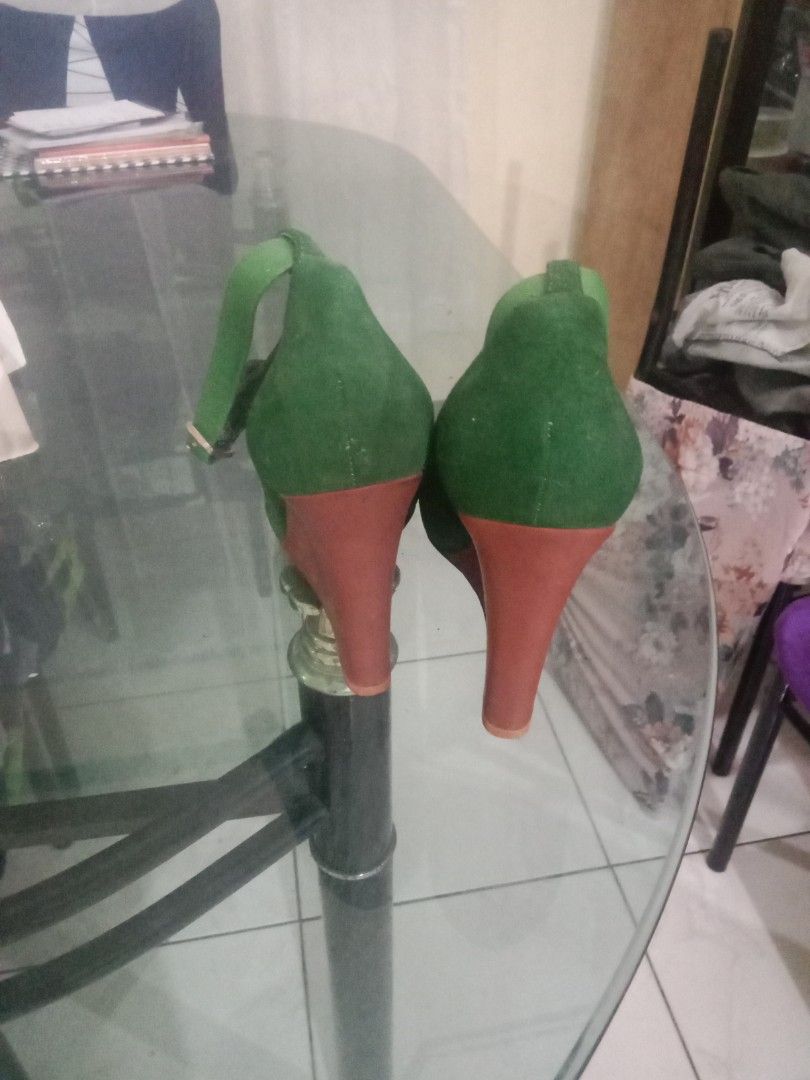 Celine Paris Green Suede Wedge Heels (Category: Wedges) located in Rosario. Submitted by gmarilyn1934608 (Listing ID 1444860414, Image 3). Description: - Celine Paris green suede wedge heels - Contrasting reddish-brown wedge heel - Ankle strap with small gold buckle detail - Soles show some wear.