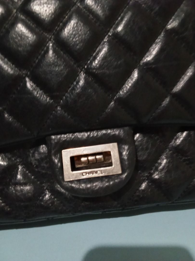 Chanel Black 2.55 Reissue Classic Double Flap Bag (Category: Luxury Bags & Wallets) located in Bacolod City. Submitted by darladadiv81581 (Listing ID 1445007416, Image 2). Description: - Classic Chanel flap bag - Black quilted leather - Iconic interlocking CC logo clasp - Chain strap for shoulder/crossbody wear - Burgundy interior - Timeless piece.