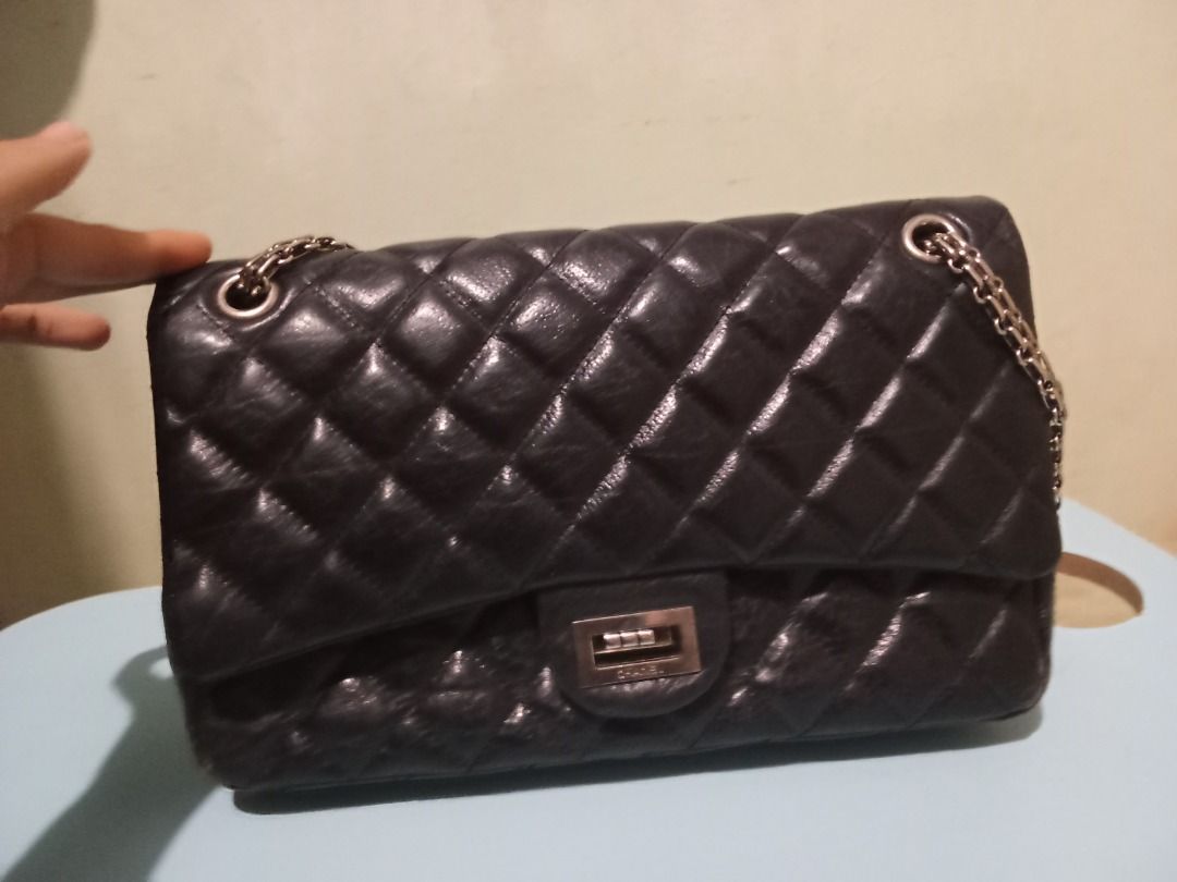 Chanel Black 2.55 Reissue Classic Double Flap Bag (Category: Luxury Bags & Wallets) located in Bacolod City. Submitted by darladadiv81581 (Listing ID 1445007416, Image 1). Description: - Classic Chanel flap bag - Black quilted leather - Iconic interlocking CC logo clasp - Chain strap for shoulder/crossbody wear - Burgundy interior - Timeless piece.