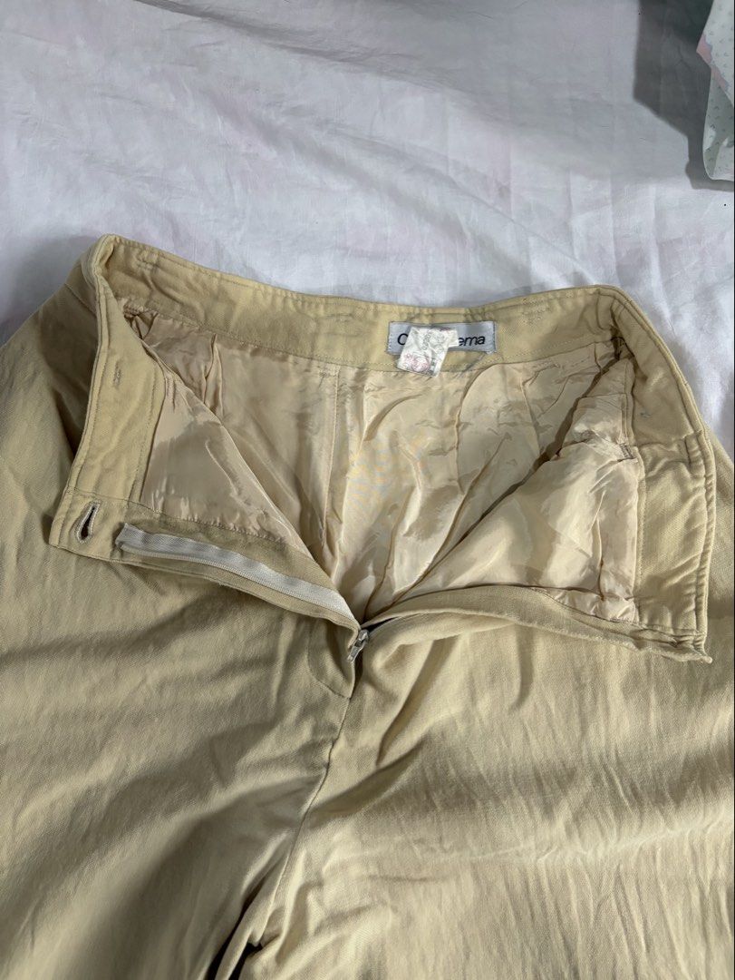 Claude Lema Beige Wide Leg Trousers (Category: Other Bottoms) located in Taguig. Submitted by amiwear (Listing ID 1445014012, Image 3). Description: - Beige wide leg trousers from Claude Lema - High waisted design - Zip and button closure - Pleated front detail - Made from a comfortable linen blend fabric - Versatile for casual or smart casual outfits Size: Small to Medium RFS: Declutterring Condition: 7/10 still in good condition Mode of Payment