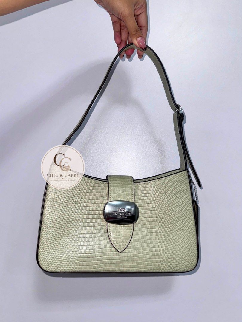 Coach Eliza Shoulder Bag - Pale Green Lizard Embossed (Category: Luxury Bags & Wallets) located in Quezon City. Submitted by chicandcarry.ph (Listing ID 1445024821, Image 1). Description: ✨Like new with excellent condition 🌸 Clean inside and out 🤎 Inclusion: Care card 📩 PM for more photos and inquires.