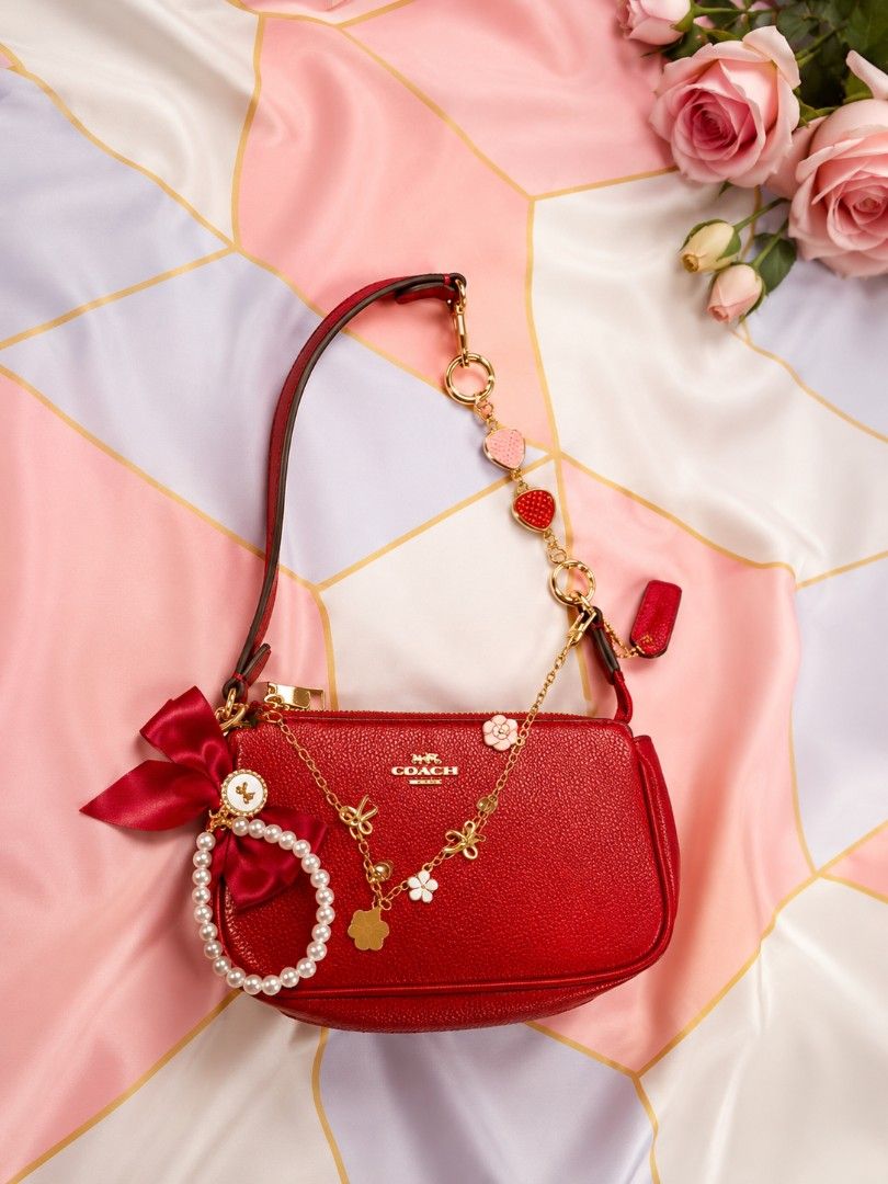 Coach Nolita Red (Category: Luxury Bags & Wallets) located in Naguilian. Submitted by jonalyndel00622 (Listing ID 1444894476, Image 1). Description: - Adorable red Coach kili bag - bag accessories not included - Perfect for adding a pop of color - Ideal size for carrying essentials.