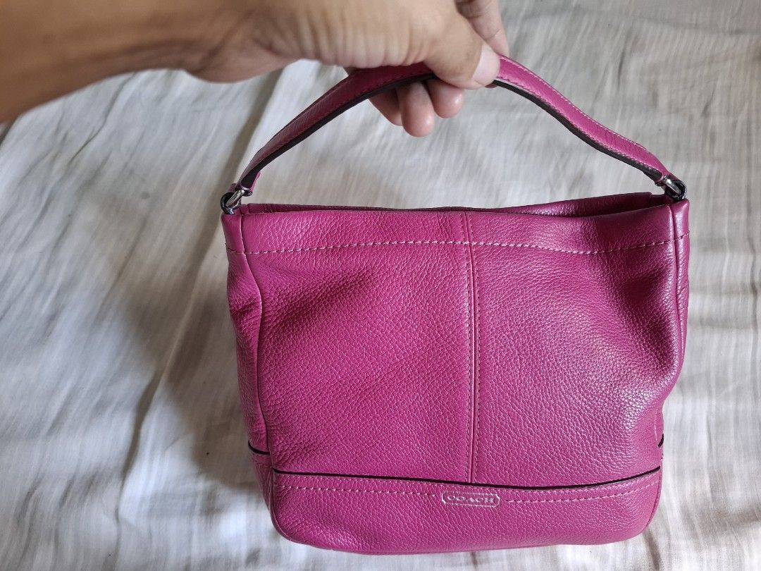 Coach Pink Leather Hobo Shoulder Bag (Category: Luxury Bags & Wallets) located in Manila. Submitted by bellybelly20 (Listing ID 1444886591, Image 3). Description: - Cute pink Coach hobo bag - Made of textured leather - Zip closure - Single shoulder strap - Embossed Coach logo on the front - Spacious interior for essentials - Great for everyday use.