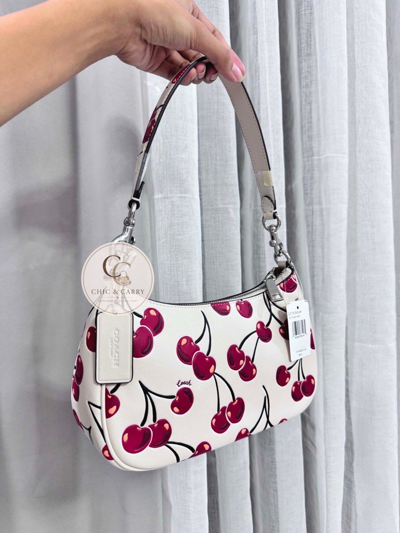 Coach Teri Shoulder Bag - Cherry Print (Category: Luxury Bags & Wallets) located in Quezon City. Submitted by chicandcarry.ph (Listing ID 1445036554, Image 2). Description: ✨ Brand New 🤎 Complete with 2 starps, Tag , Care Card & Polyplastic 📩 PM for more photos and inquiries .