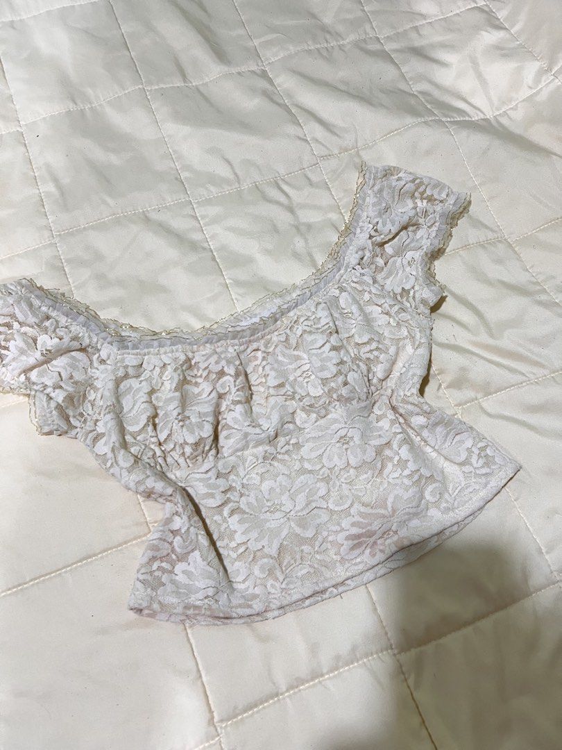 Cream Lace Off-Shoulder Crop Top (Category: Others Tops) located in Roxas City. Submitted by plumpop_ (Listing ID 1444912210, Image 3). Description: - Cute cream lace crop top - Off-shoulder style - Short puff sleeves - Ruffled neckline and hem - Pairs well with high-waisted jeans or skirts - Feminine and pretty design - Ideal for summer days or casual evenings.