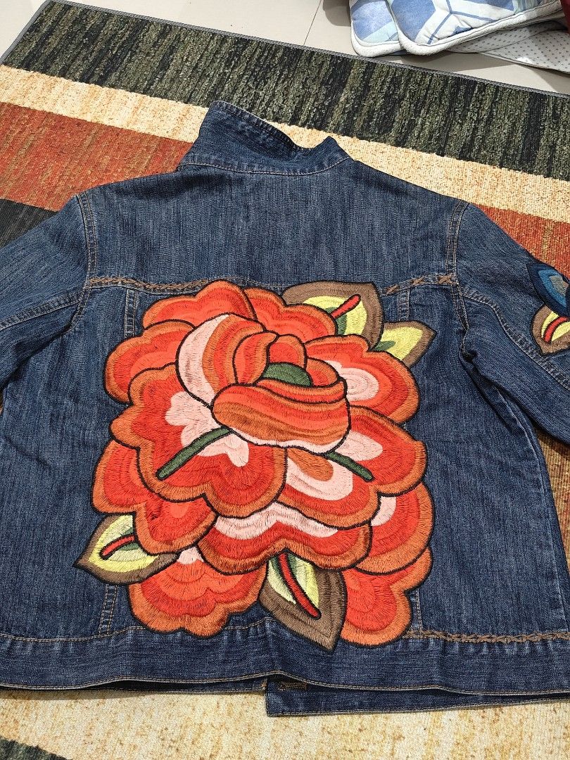Denim jacket large orange floral embroidery levis jacket (Category: Coats, Jackets and Outerwear) located in Bulacan. Submitted by tipidayos (Listing ID 1444886646, Image 1). Description: Chico's denim jacket features a large, bohemian-style orange floral embroidery on the back Brand: Chico's made in hong kong. Size W20.5 x L23.5 Still in very good condition Meetup malolos or shipping.
