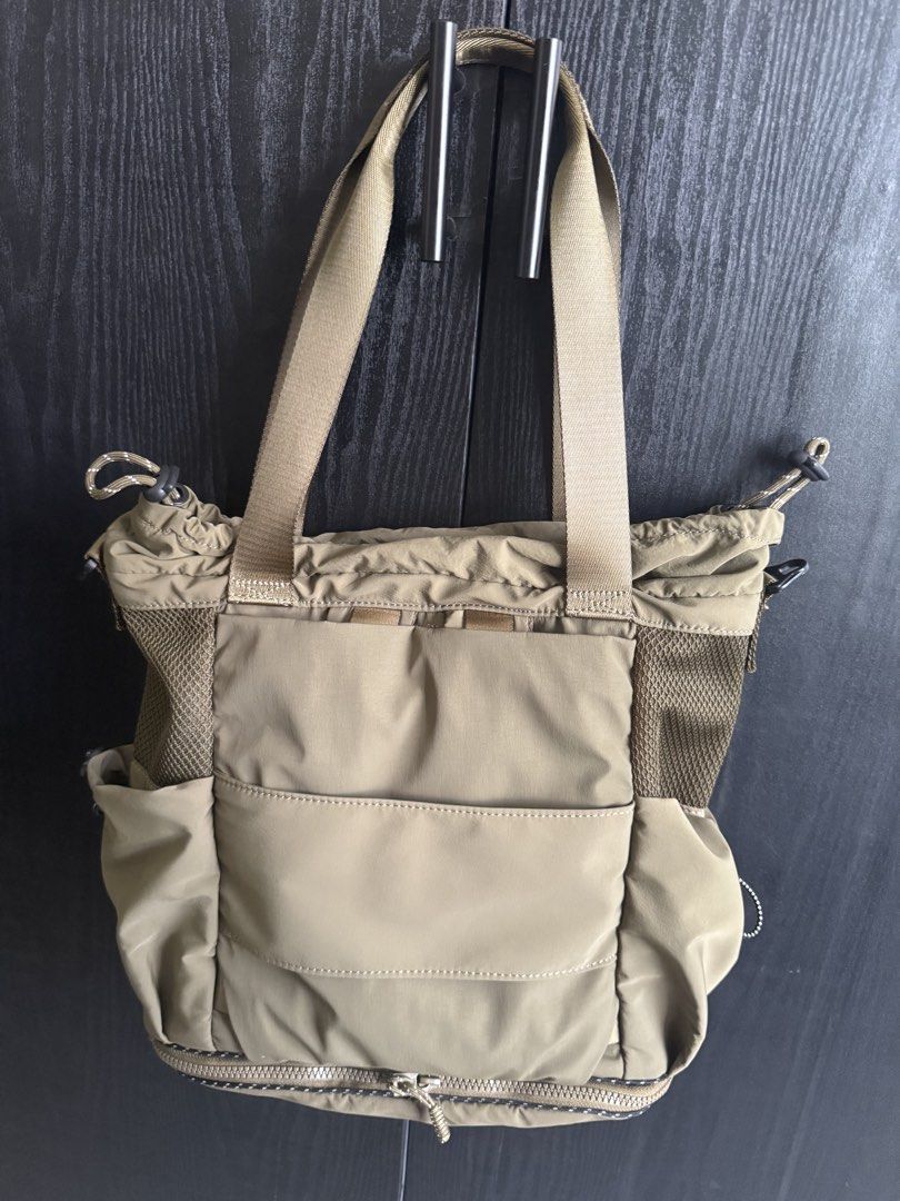 Desigual Khaki Nylon Tote Backpack 2way Bag (Category: Tote Bags) located in Mandaluyong City. Submitted by bookmarkdown (Listing ID 1445028424, Image 3). Description: - Bought for 6k+ - Barely used - Khaki green Desigual two-way bag - tote bag and backpack - Expandable (zippered below) - Durable nylon material - Multiple pockets inside and out for organization - Mesh details on the sides - Adjustable straps - Drawstring closure at the top - Idea