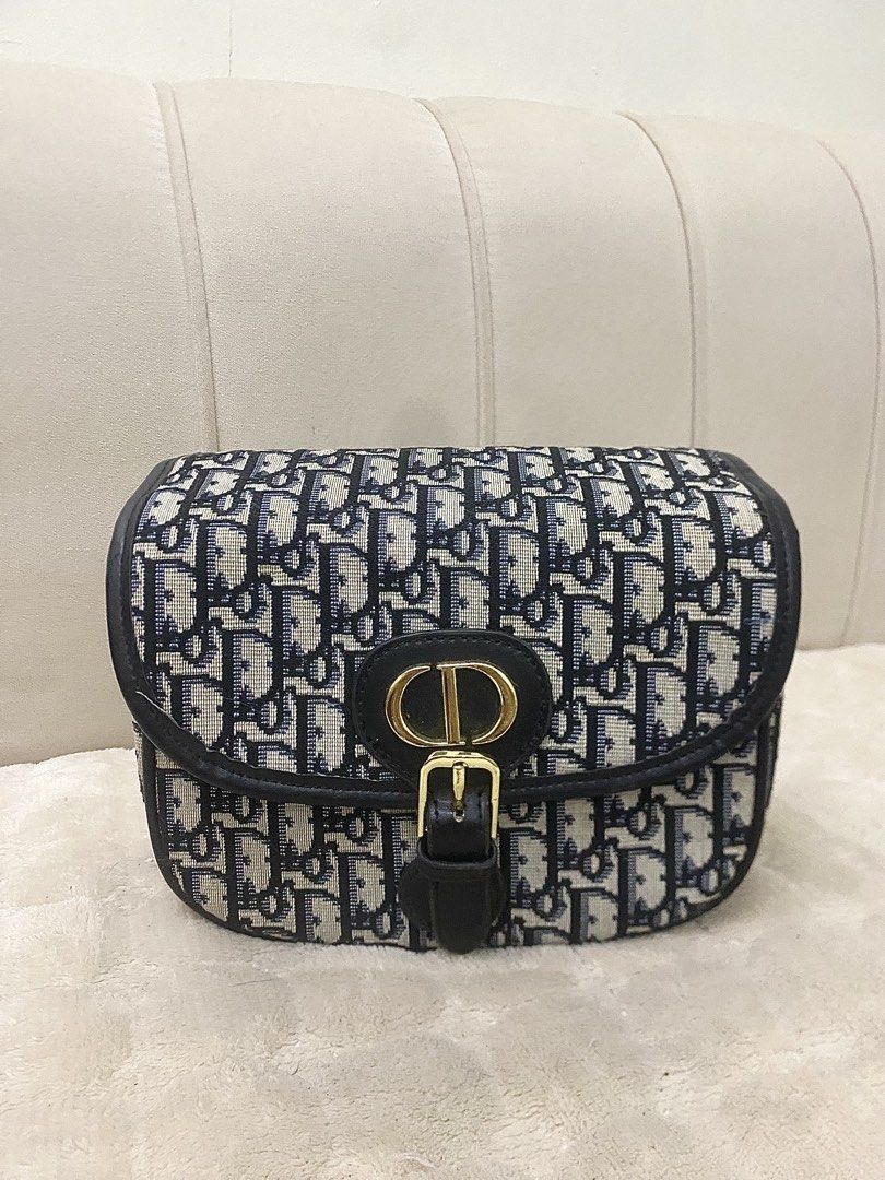 Dior Monogram Saddle Bag (RUSH‼️) (Category: Luxury Bags & Wallets) located in Tarlac. Submitted by shannie.e8 (Listing ID 1444883405, Image 1). Description: - Iconic Dior saddle bag - Classic monogram pattern - Black leather trim - Gold hardware - Front buckle closure - Never been used - GCASH PAYMENT - rfs: need funds for school.