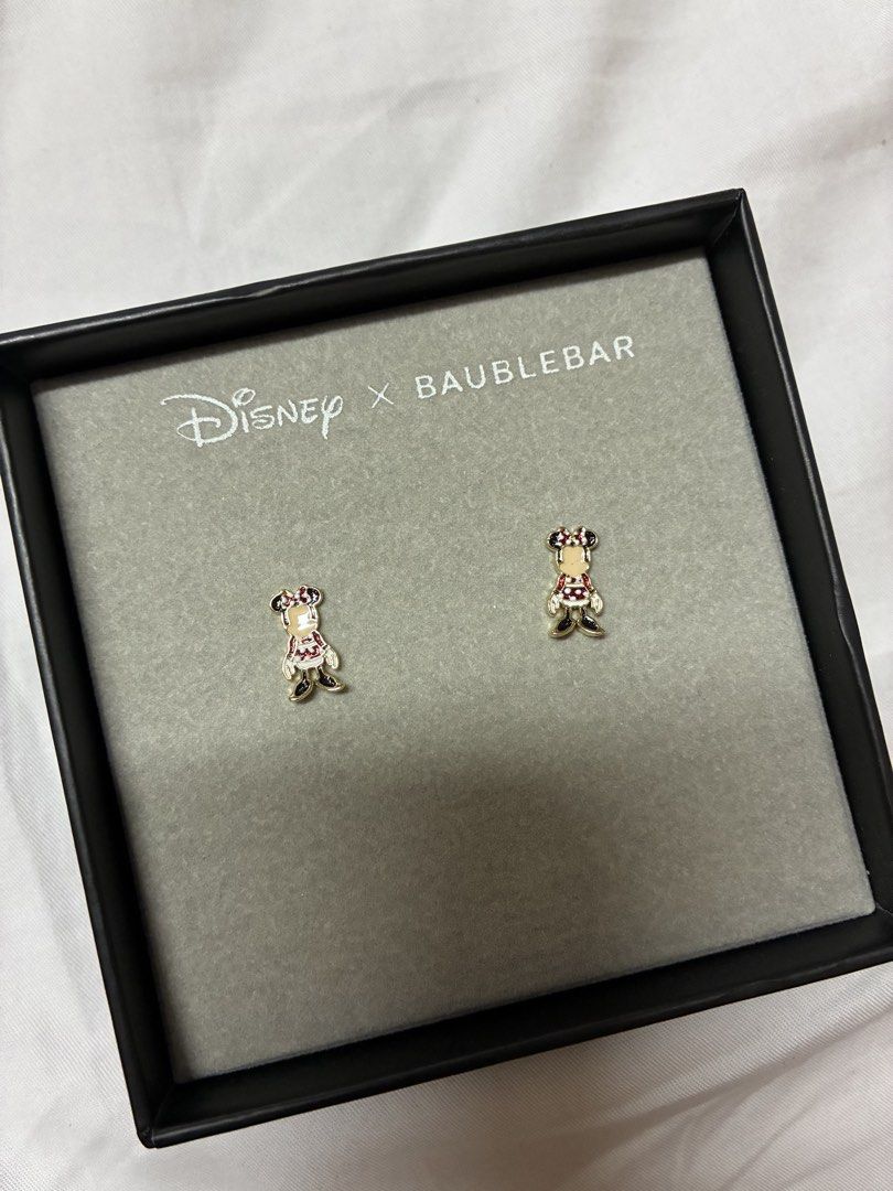 Disney x BaubleBar Minnie Mouse small Earrings (Category: Earrings) located in Quezon City. Submitted by habits.mnl (Listing ID 1444950951, Image 1). Description: - Adorable Minnie Mouse earrings - Collaboration: Disney x BaubleBar - Material: Gold-toned with red and white enamel details - Condition: Brand new, comes in original box - Perfect gift for any Disney enthusiast!.