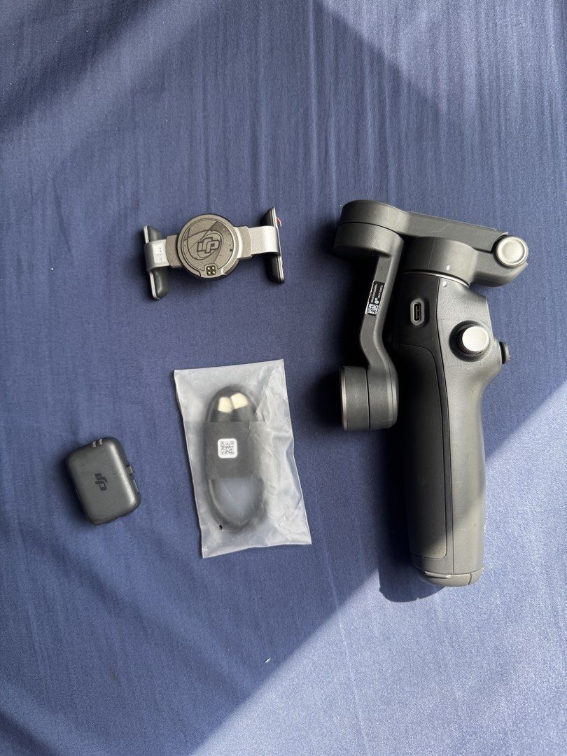 DJI OM 7/7P Gimbal Stabilizer with Accessories and Case (Category: Gimbals & Stabilizers ) located in Cagayan de Oro. Submitted by puretiger_38e27a (Listing ID 1444920535, Image 2). Description: - DJI OSMO MOBILE 7P gimbal stabilizer - Includes phone clamp - Comes with charging cable - Hard case for storage and transport - Ideal for achieving smooth video footage.