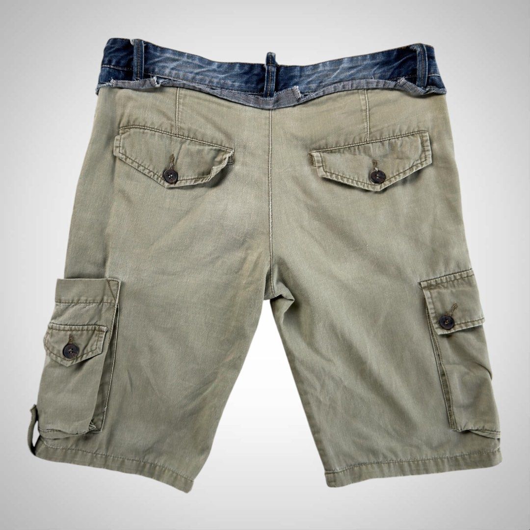 Dolce & Gabbana 2004 Hybrid Cargo Shorts (Category: Activewear) located in Zamboanga. Submitted by the.angura.store (Listing ID 1444922892, Image 2). Description: Dolce & Gabbana Hybrid Cargo Shorts Prepare to be dazzled by an exceptionally rare find: a pair of cargo green shorts from the prestigious fashion house D&G, adorned with a double denim waist. This extraordinary piece is a testament to D&G’s commitment to innovation and luxury, making i