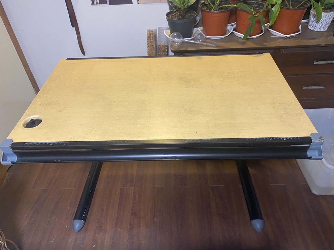 Drafting Table (Category: Office Furniture & Fixtures) located in Angeles City. Submitted by teysdeclutter (Listing ID 1444988501, Image 1). Description: ❗️FOR SALE: DRAFTING TABLE ❗️ 📍Location: Porac, Pampanga - Still in good condition - RFS: Di na po nagagamit for drafting - Adjustable height & tilting top - Negotiable price! 📩 PM if interested Note: shipping fee will be shouldered by buyer.