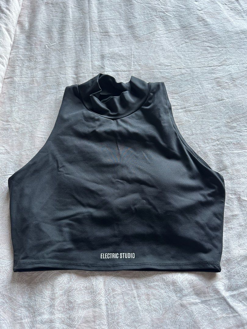 ELECTRIC STUDIO Black Mock Neck Crop Top Size M (Category: Sleeveless) located in Muntinlupa City. Submitted by stuffbya (Listing ID 1444872641, Image 1). Description: - Electric Studio black mock neck crop top - Size: Medium - Proudly made in the Philippines - Comfortable and stylish - Versatile for activewear or casual outfits - Features a chic high neckline.