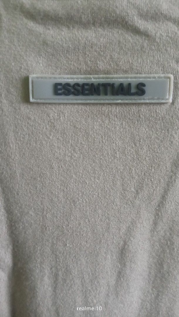 Fear of God Essentials T-Shirt Size L (Category: Tshirts & Polo Shirts ) located in Manila. Submitted by frostindustry888 (Listing ID 1445023802, Image 3). Description: - Grey Fear of God Essentials T-shirt - Classic Essentials logo printed on the front - Rubberized logo patch on the chest - Made from 100% cotton this is not a trift original bought from the the official website - Tagged size L - Ideal for everyday wear .