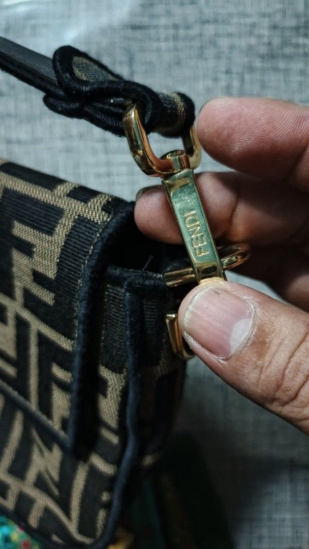 Fendi Baguette Monogram Canvas Shoulder Bag (Category: Luxury Bags & Wallets) located in Makati City. Submitted by macdwyneki84361 (Listing ID 1444968833, Image 2). Description: - Authentic Fendi Baguette Bag - Classic Zucca Monogram Canvas - Gold Hardware with Fendi Logo - Interior "Made in Italy" and "Baguette" Labels - Visible Serial Number Inside - Adjustable Strap - Ideal for Everyday Use.