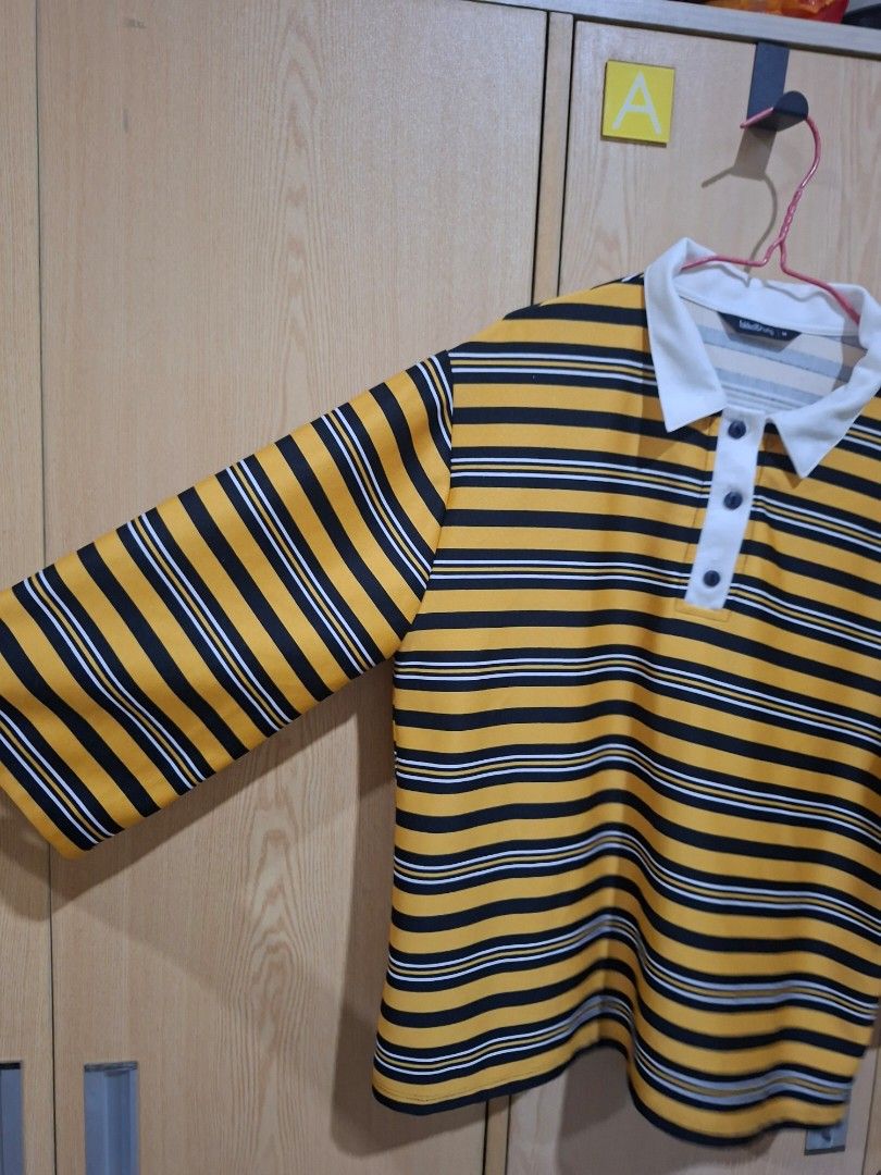 Folded & Hung Striped Polo Shirt (Category: Tshirts & Polo Shirts ) located in Santa Barbara. Submitted by hotarunn (Listing ID 1445039414, Image 3). Description: - Brand: Folded & Hung - Color: Yellow and black stripes - Style: Long sleeve polo shirt - Features: White collar and button placket - Size: Medium (M) - Occasion: Casual wear.