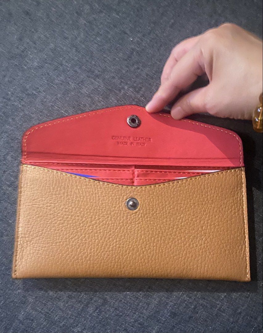 Genuine Leather Envelope Wallet Made in Italy (Category: Wallets & Card holders) located in Manila. Submitted by jrprelovedshop (Listing ID 1445032091, Image 2). Description: 👜 Minimalist Leather Envelope Wallet ✨ Chic & functional everyday wallet Perfect for those who love clean, minimalist style with a pop of color inside 💛❤️ - Genuine Italian leather - Tan exterior with a vibrant coral interior - Secure snap closure - Ample space for cards a