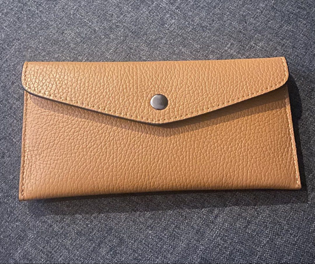Genuine Leather Envelope Wallet Made in Italy (Category: Wallets & Card holders) located in Manila. Submitted by jrprelovedshop (Listing ID 1445032091, Image 1). Description: 👜 Minimalist Leather Envelope Wallet ✨ Chic & functional everyday wallet Perfect for those who love clean, minimalist style with a pop of color inside 💛❤️ - Genuine Italian leather - Tan exterior with a vibrant coral interior - Secure snap closure - Ample space for cards a