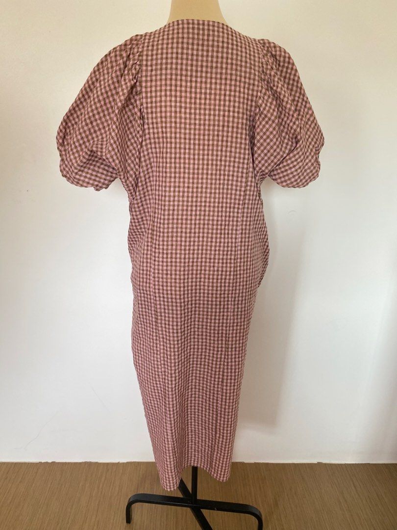 Gingham Puff Sleeve Midi Dress with Buttons (Category: Dresses) located in Santa Rosa. Submitted by summerbrunch (Listing ID 1444861308, Image 2). Description: MANNEQUIN SIZE: Medium Can fit large- XL very nice when worn - Adorable pink and brown gingham pattern - Midi length with stylish puff sleeves - Functional button-up front - Convenient pockets included! - Ideal for casual outings and everyday wear.