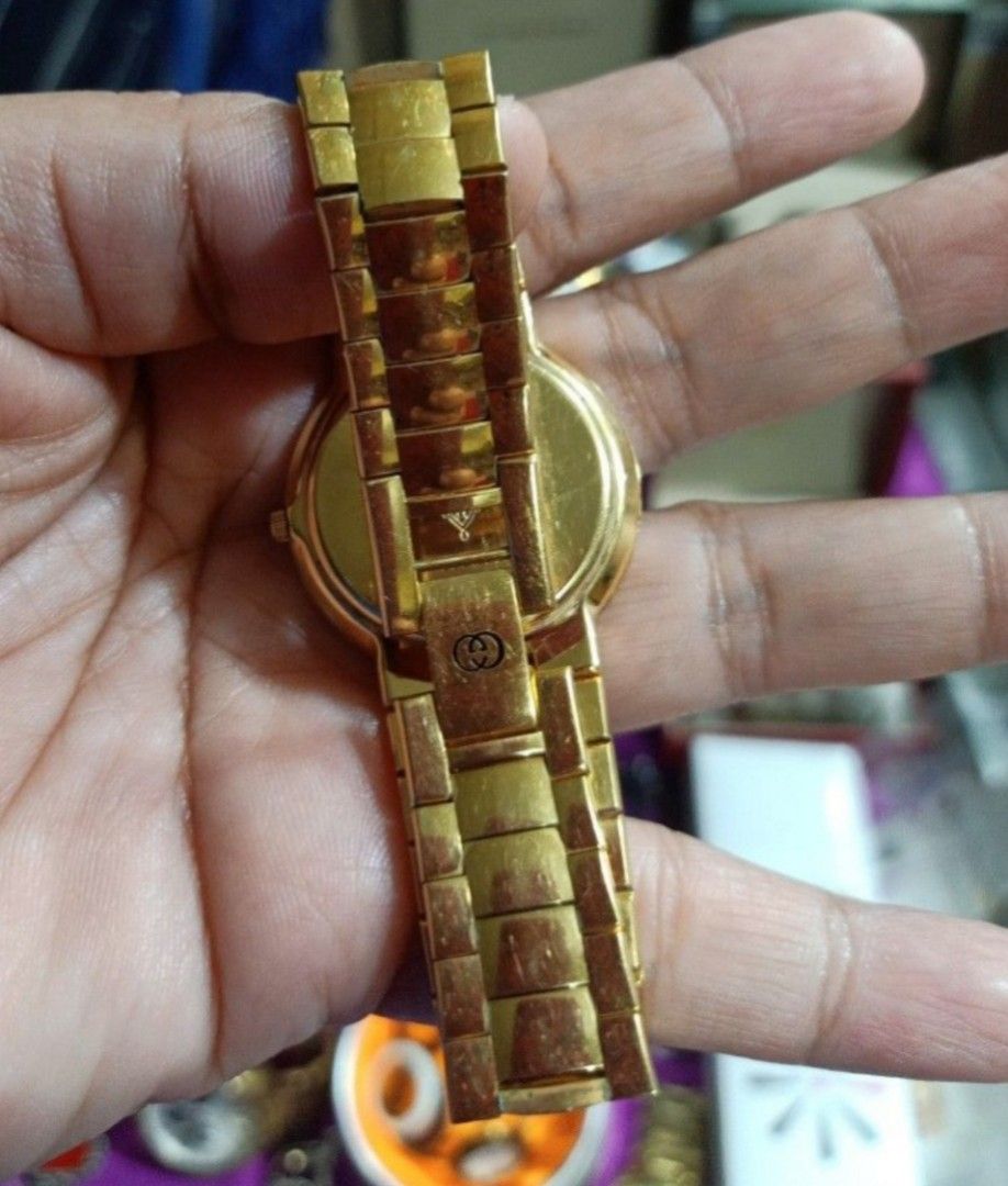 Gucci 3300 M Gold Plated Watch (Category: Women's Watches) located in Cagayan de Oro. Submitted by mmmdshop (Listing ID 1444863654, Image 3). Description: - Authentic Gold Plated Gucci Watch - Model: 3300 M - Features a classic white dial with elegant Roman numerals - Comfortable bracelet strap - Fully functional and working well well used expect sign of usage. .