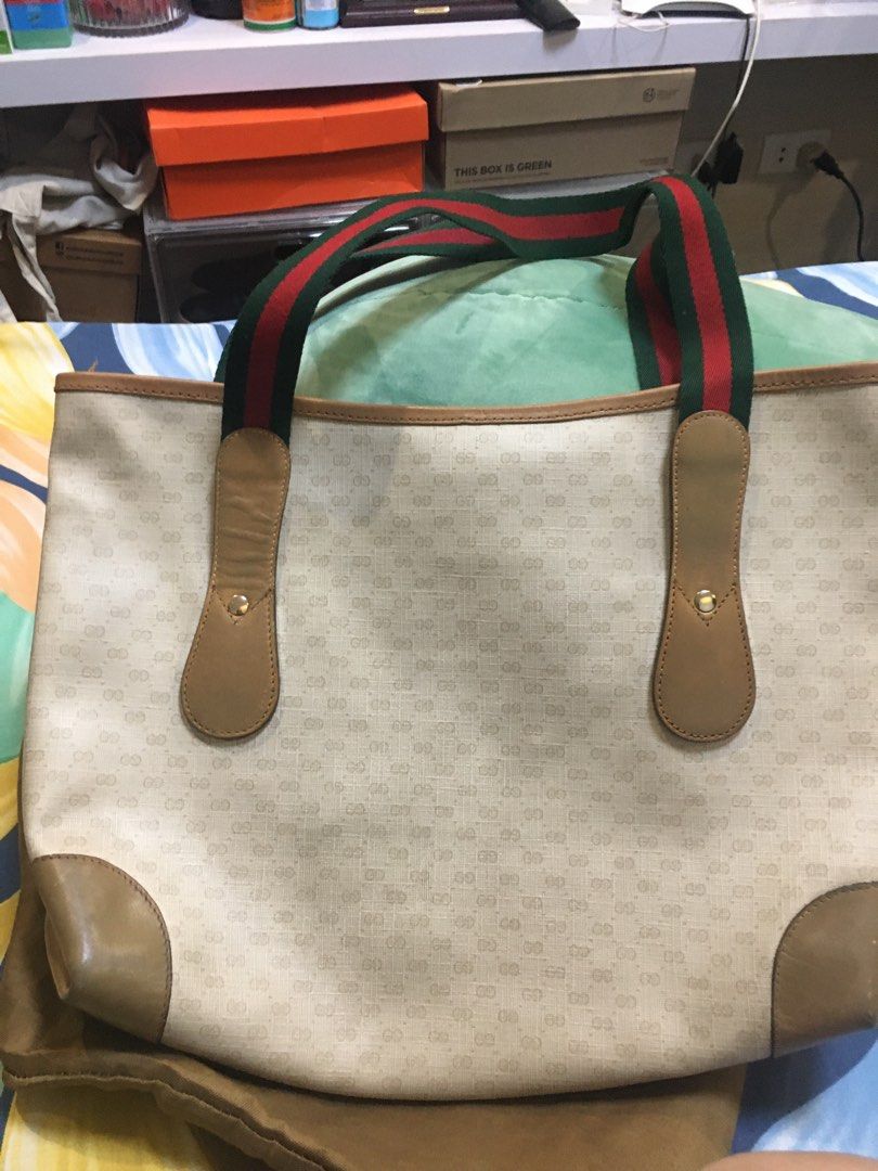 Gucci Tote (Category: Luxury Bags & Wallets) located in San Pedro. Submitted by ginasantiago (Listing ID 1444987932, Image 2). Description: Vintage Gucci tote bag. Beige GG monogram canvas with tan leather trim and straps featuring the iconic green and red stripe. Some wear on leather/canvas, interior is clean. Classic everyday bag. RE-STRUCTURED.