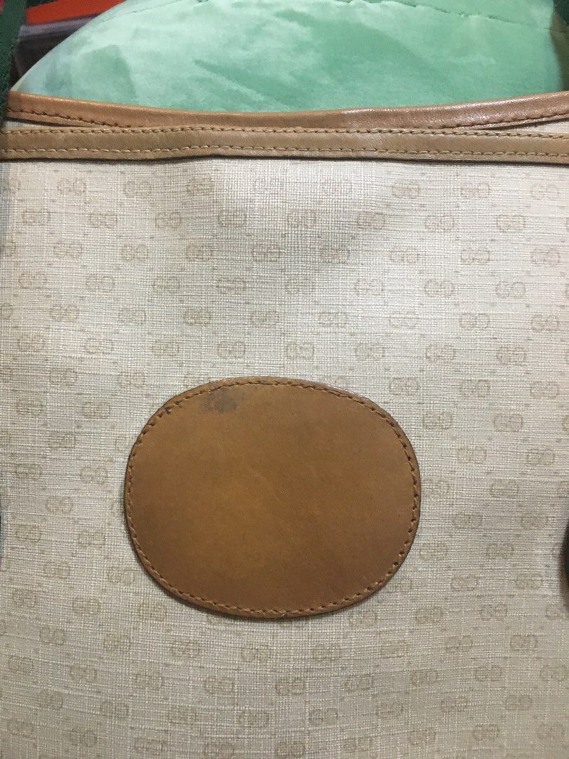 Gucci Tote (Category: Luxury Bags & Wallets) located in San Pedro. Submitted by ginasantiago (Listing ID 1444987932, Image 3). Description: Vintage Gucci tote bag. Beige GG monogram canvas with tan leather trim and straps featuring the iconic green and red stripe. Some wear on leather/canvas, interior is clean. Classic everyday bag. RE-STRUCTURED.