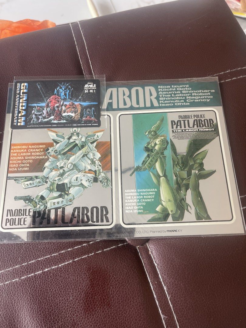 Gundam & Patlabor 20th Anniversary Collectible Cards (Category: Raw Cards) located in Singapore. Submitted by wonderswiss (Listing ID 1444880661, Image 1). Description: - Set of collectible Gundam and Mobile Police Patlabor cards. - Features a special 20th Anniversary Gundam card. - Includes two Mobile Police Patlabor cards. - Perfect for fans of classic mecha series. - All cards are kept in protective sleeves..