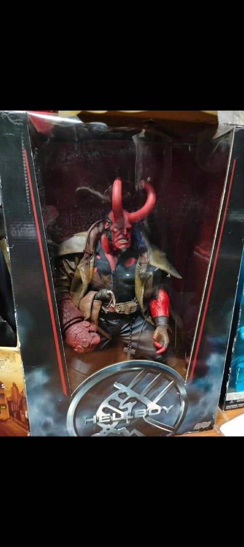 Hellboy Action Figure in Box (Category: Figurines & Statues) located in Manila. Submitted by chavezjofe92080 (Listing ID 1445003702, Image 1). Description: - Authentic Hellboy action figure - Comes in original, unopened packaging - Highly detailed sculpt showcasing his iconic red skin and horns - Perfect for Hellboy enthusiasts and action figure collectors.