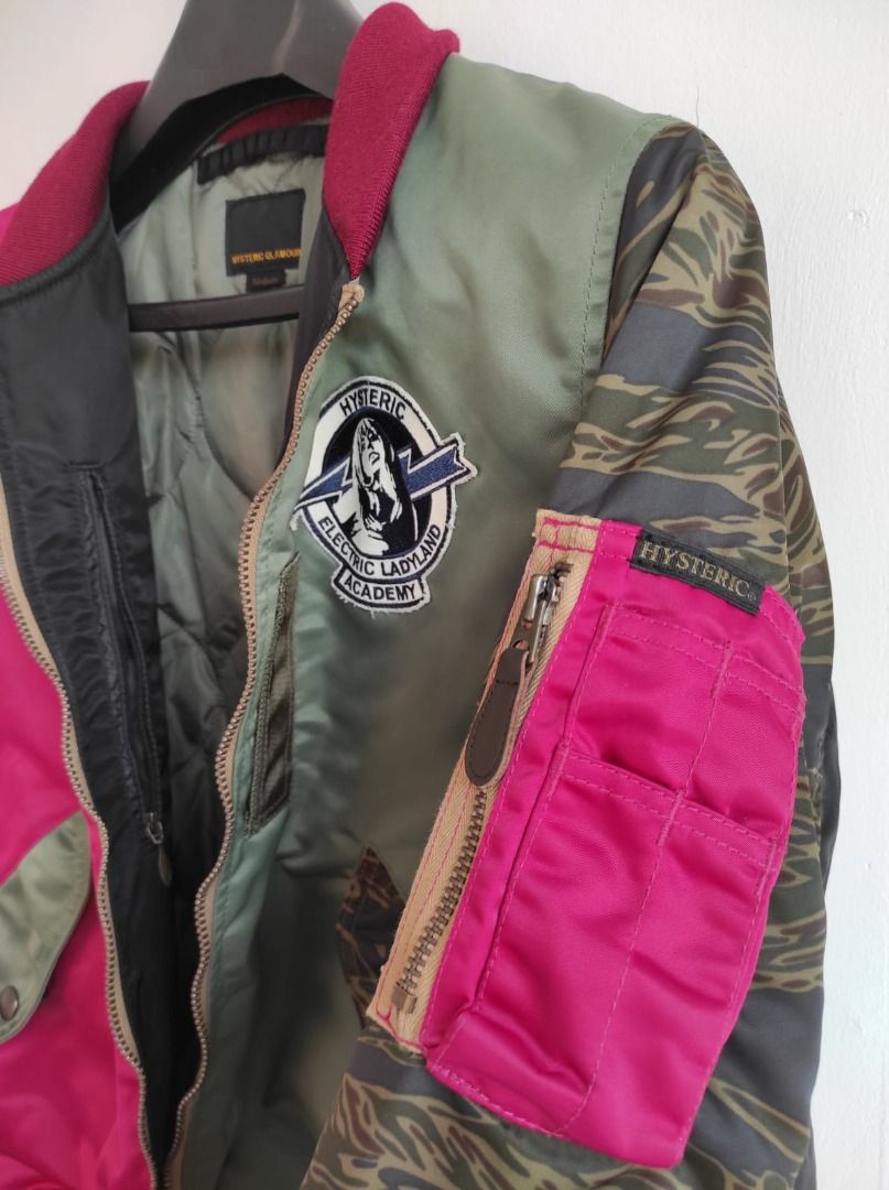 HYSTERIC GLAMOUR PrimaLoft Air Force Crazy Color L-2B Jacket (Category: Luxury Apparel) located in Pasay City. Submitted by highkeys (Listing ID 1445015638, Image 2). Description: - Hysteric Glamour bomber jacket - Size: Medium - Unique split design - Tiger camouflage sleeves - Patches on the chest - Ribbed cuffs and hem - Materials: Polyester, Wool, Nylon.