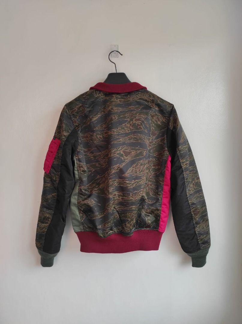 HYSTERIC GLAMOUR PrimaLoft Air Force Crazy Color L-2B Jacket (Category: Luxury Apparel) located in Pasay City. Submitted by highkeys (Listing ID 1445015638, Image 3). Description: - Hysteric Glamour bomber jacket - Size: Medium - Unique split design - Tiger camouflage sleeves - Patches on the chest - Ribbed cuffs and hem - Materials: Polyester, Wool, Nylon.