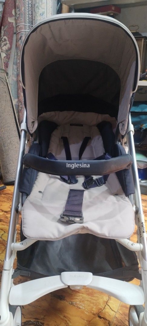 Inglesina Stroller (Category: Strollers) located in Caloocan City. Submitted by rowely_jpn (Listing ID 1444960987, Image 1). Description: Inglesina stroller. Beige and navy blue colorway. Has a 5-point harness for safety. Storage basket underneath. Easy to maneuver wheels. Folds for storage. Great for outings with your little one..
