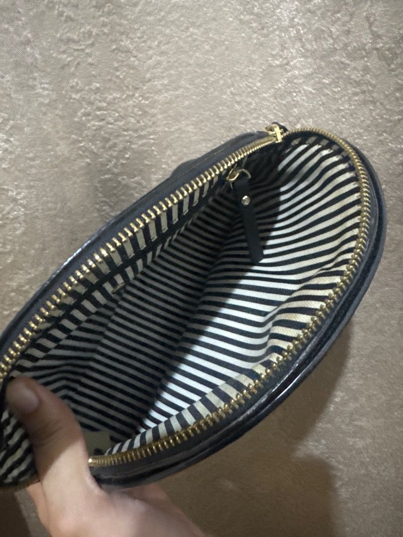 Kate Spade Crossbody Bag (Category: Luxury Bags & Wallets) located in Caloocan City. Submitted by epicphoenix_689501 (Listing ID 1444958029, Image 3). Description: - Authentic Kate Spade cosmetic bag - Color: Black - Material: Saffiano Leather - Style: Dome shape - Closure: Zipper - Ideal for travel or everyday use - Compact and great for organizing essentials.