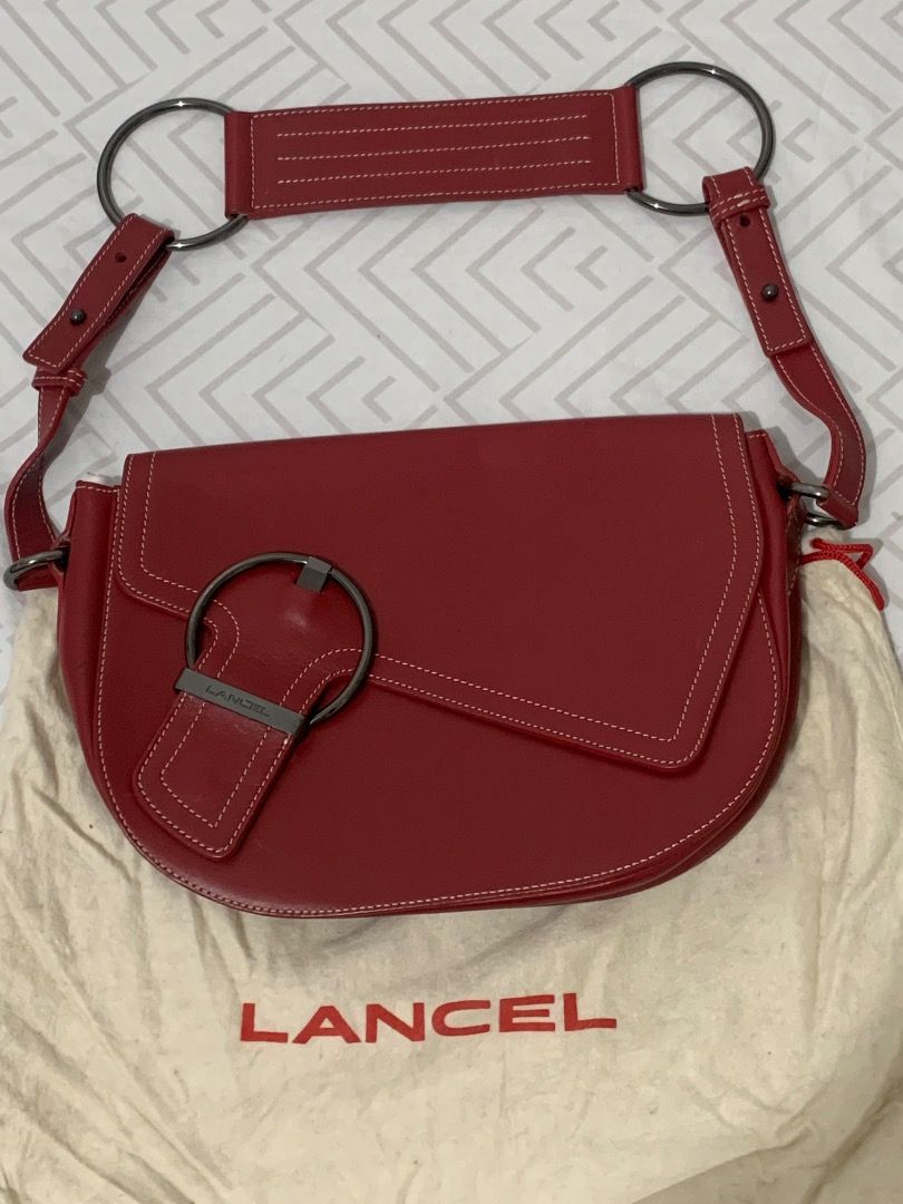 Lancel Paris Red Leather Shoulder Bag (Category: Luxury Bags & Wallets) located in Lapu Lapu. Submitted by goodfindsbyshee (Listing ID 1445012512, Image 1). Description: - Authentic Lancel Paris red leather shoulder bag - Clean interior with a convenient zipped pocket - Stylish white stitching details on the exterior - Comes with original dust bag for protection - Ideal for everyday use, adding a pop of color to your outfits.