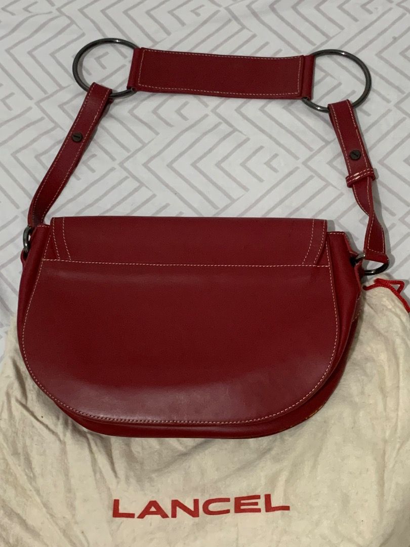 Lancel Paris Red Leather Shoulder Bag (Category: Luxury Bags & Wallets) located in Lapu Lapu. Submitted by goodfindsbyshee (Listing ID 1445012512, Image 2). Description: - Authentic Lancel Paris red leather shoulder bag - Clean interior with a convenient zipped pocket - Stylish white stitching details on the exterior - Comes with original dust bag for protection - Ideal for everyday use, adding a pop of color to your outfits.