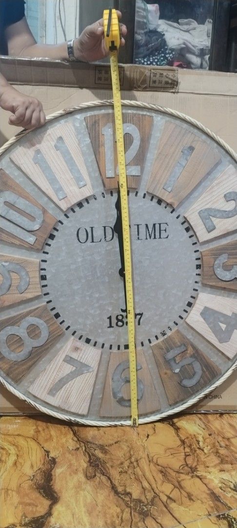 Large Vintage "Old Time" Wall Clock with Rope Trim (Category: Clocks) located in Caloocan City. Submitted by rowely_jpn (Listing ID 1444960669, Image 3). Description: Selling a large vintage-style wall clock. It has a distressed wood and metal face with "OLD TIME" and "1837" printed on it. The numbers are large and easy to read. There's a rope trim around the edge. The clock mechanism is included. Measures about 31 inches in diameter..