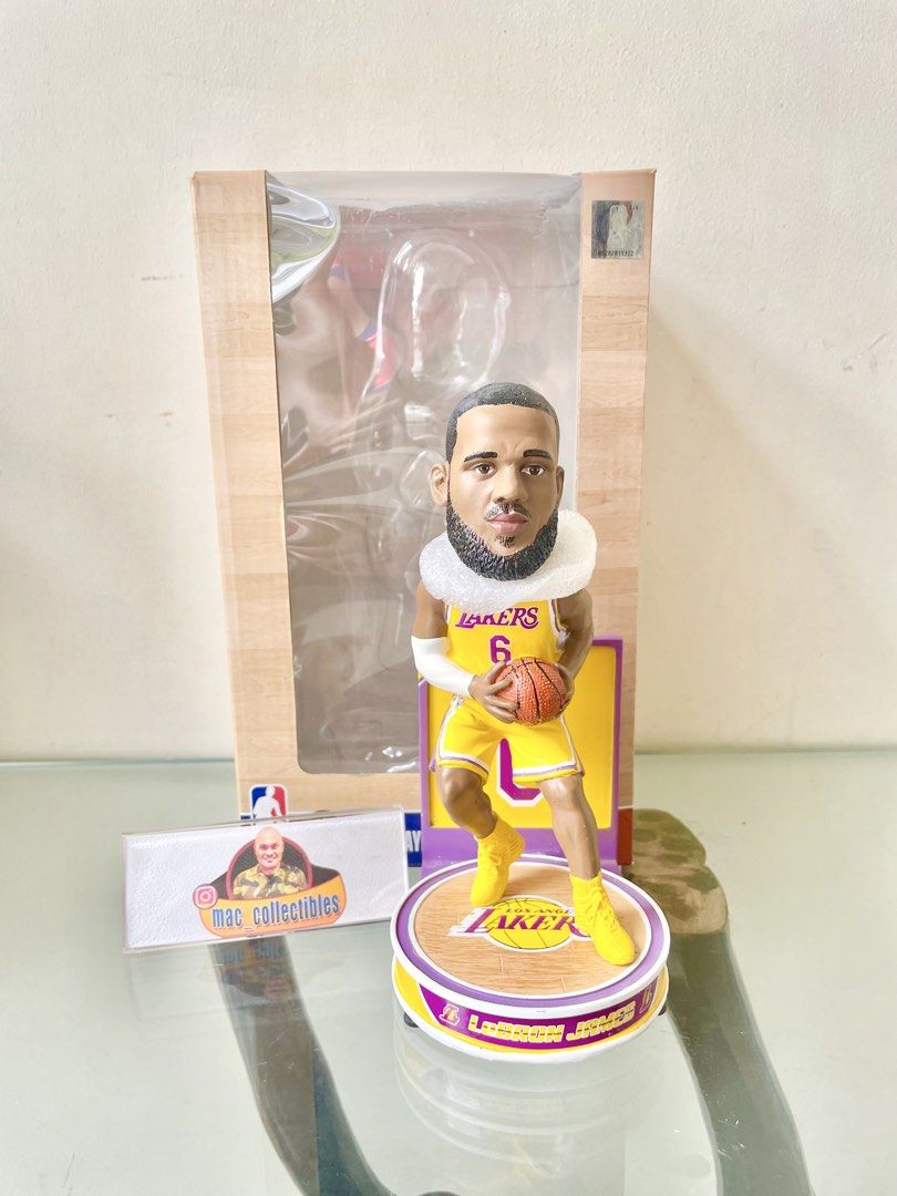 LeBron James Lakers Highlight Series Bobblehead (Category: Figurines & Statues) located in Paranaque City. Submitted by desayer02 (Listing ID 1445019038, Image 1). Description: LeBron James bobblehead in his Lakers uniform. Comes with the original box. The figure is holding a basketball. Great for any Lakers fan or collector. Display it on your desk or shelf. It was manufactured and /2022 made by Forever Collectibles (FOCO), which is the best NBA