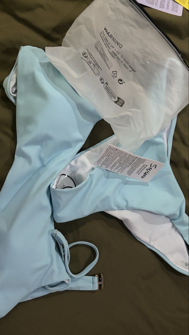 Light Blue Bikini Set - L (Category: Bikinis & Swimsuits) located in Pasig City. Submitted by usttiger (Listing ID 1444978599, Image 1). Description: - Light blue bikini set from SHEIN - SELLING FOR: ₱195 - RFS: Wrong size - Scoop neck top with adjustable straps - High-cut bottoms - Material: 80% Polyester, 20% Elastane - Includes original packaging - Ideal for beach or pool.