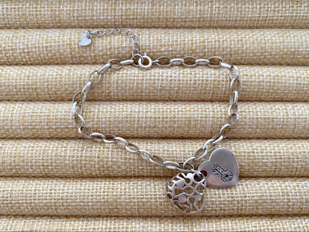Link chain charm bracelet featuring two heart pendants | S925 (Category: Bracelets) located in Solano. Submitted by silvershineph (Listing ID 1444910332, Image 1). Description: Silver link chain charm bracelet featuring two heart pendants Size: 9” Weight: 8.7.